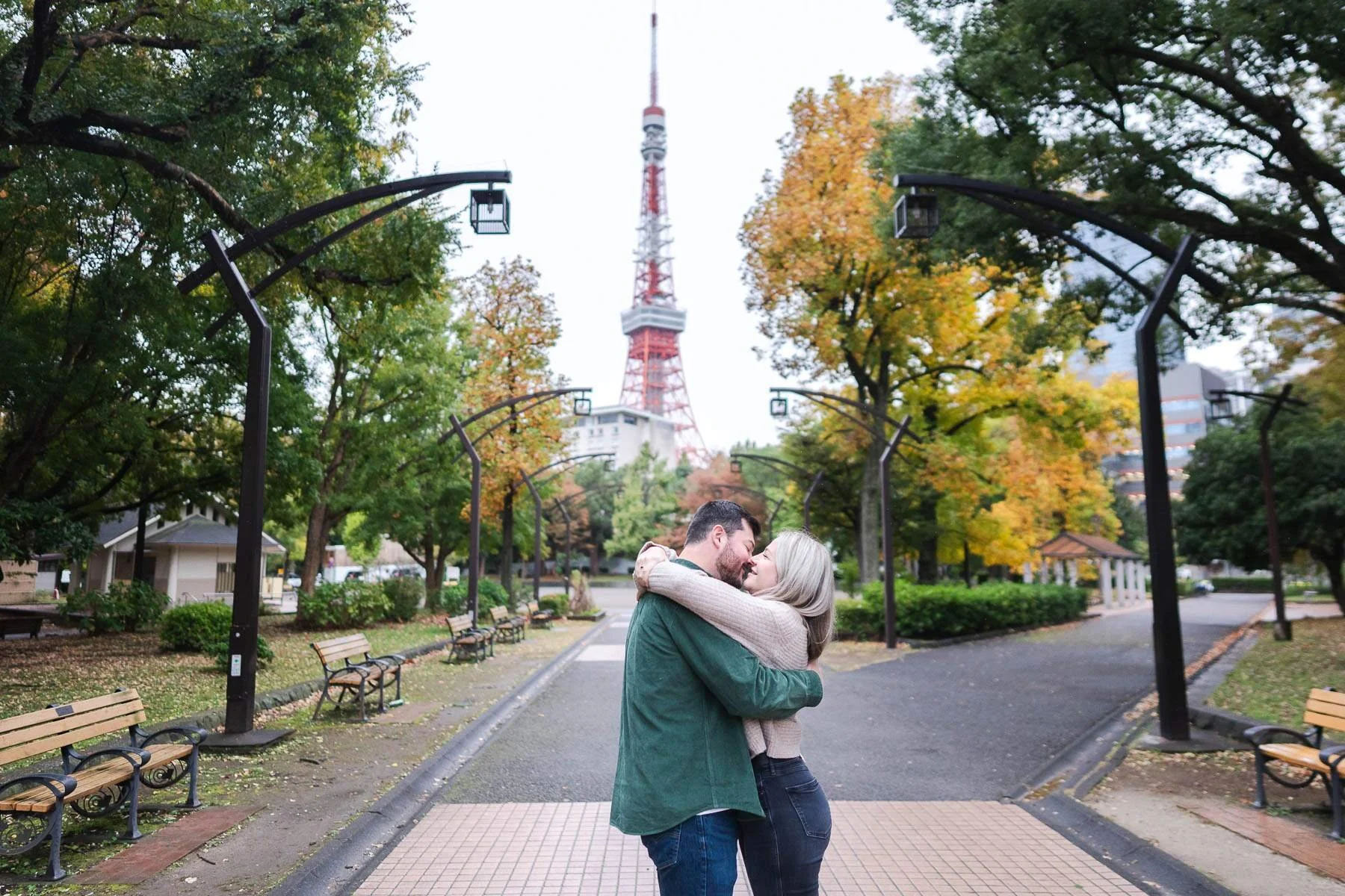 The couple embrace each other as she said Yes! It was a memorable surprise proposal in Shiba Park with Tokyo Tower view.