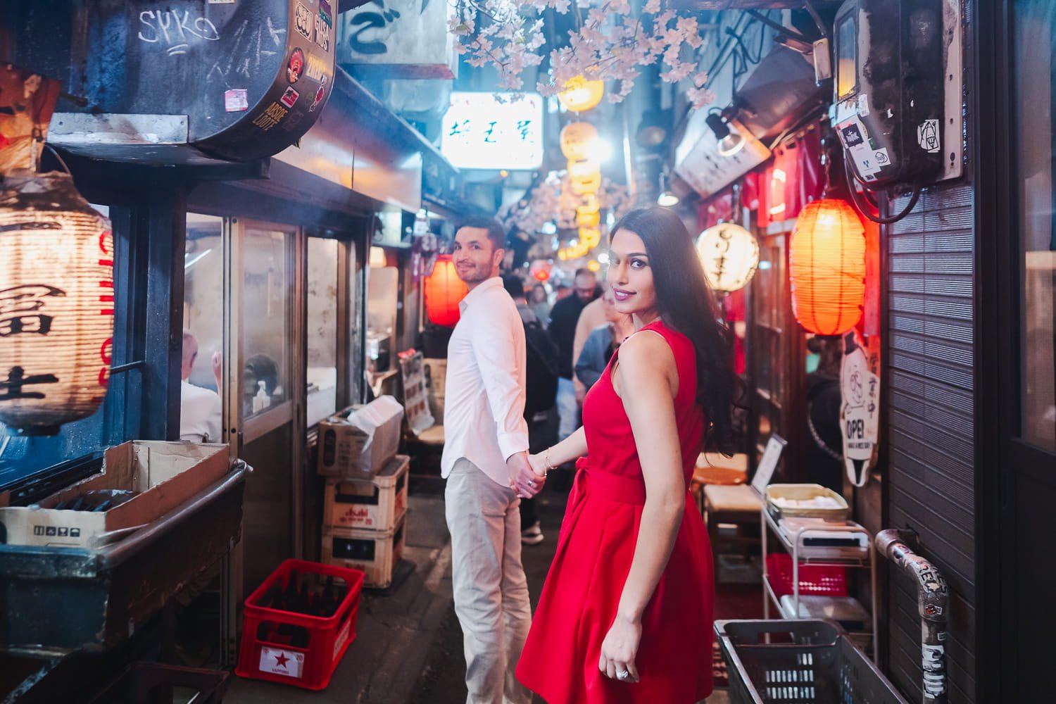 The best way to get your couple photo at the super busy Shinjuku Omoide Yokocho is to hire a local Tokyo vacation photographer