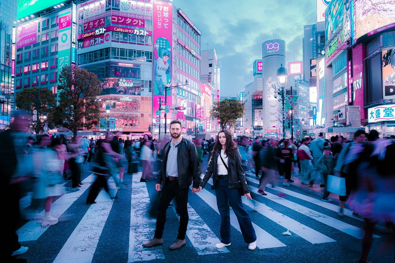 Couple stepping into Blade Runner world during cyberpunk photoshoot at Shibuya Scramble Crossing