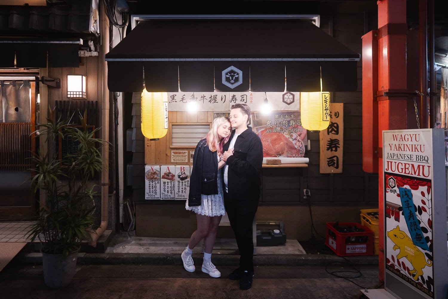 A quiet scene around Asakusa Denboin street where the couple cuddling each other under lantern lights