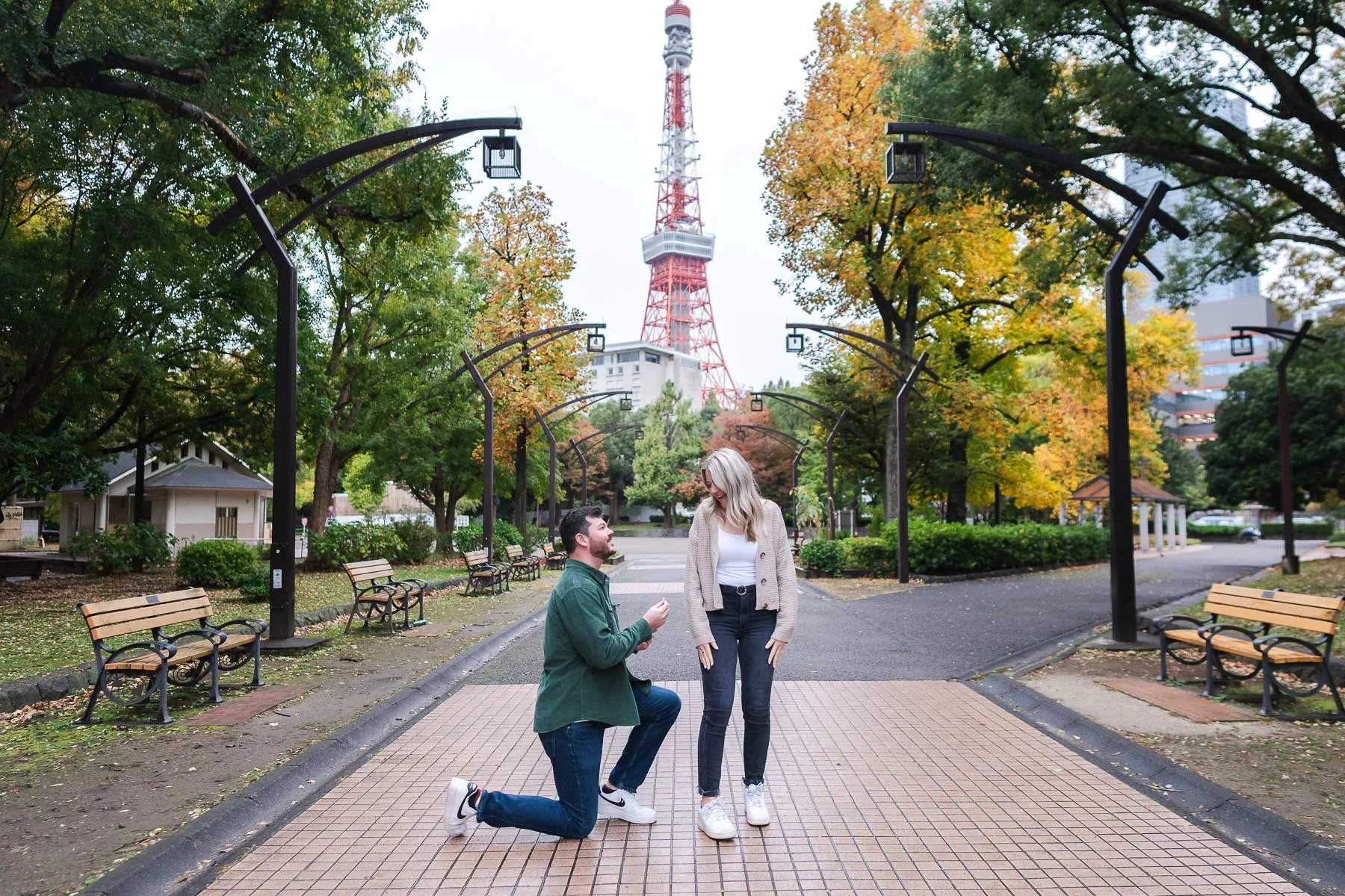 He kneeled down and asked her for her hands in marriage in front of Tokyo Tower surrounded by colorful autumn leaves