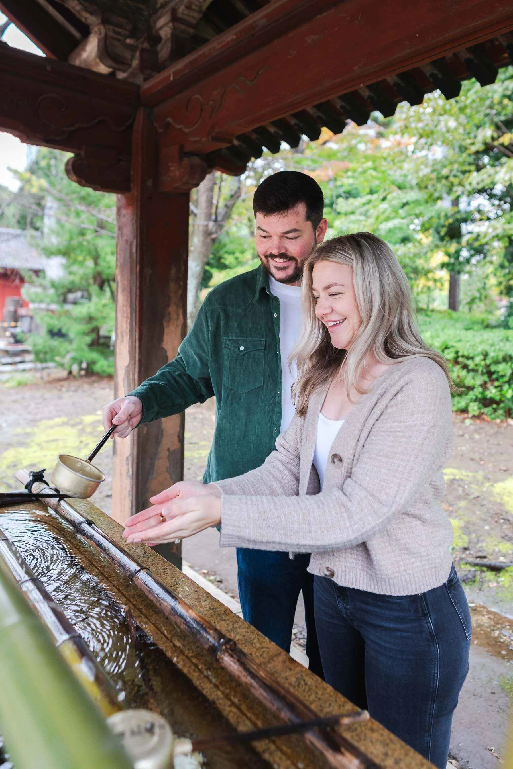 The couple washed their hands before entering Zojoji Temple