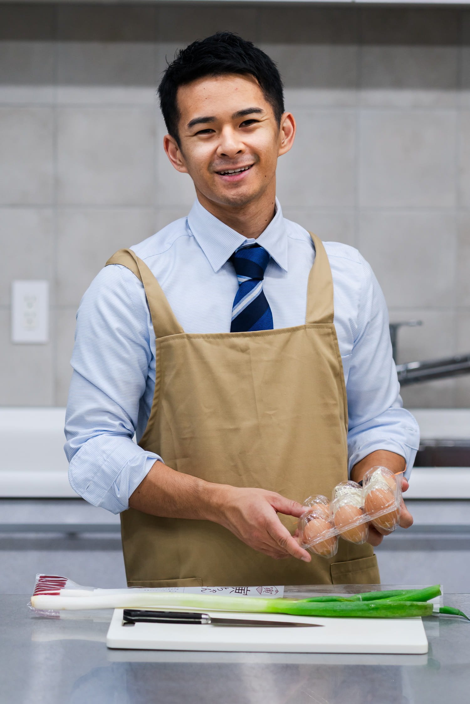 Professional photographer captured a male while cooking in the kitchen for a modeling portfolio submission