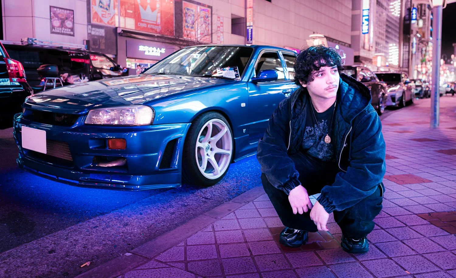 Cyberpunk photoshoot of a solo male travel who obsesses with Japanese sport cars