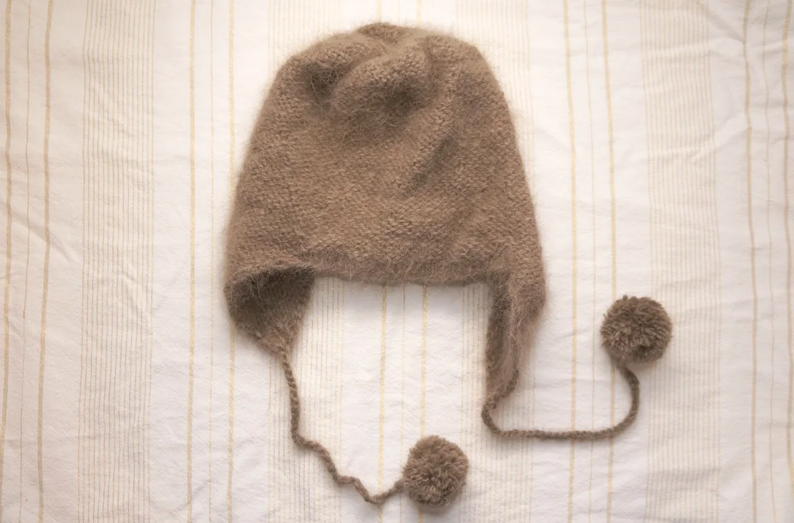 Doux Hood, capuche + pompons + doudou