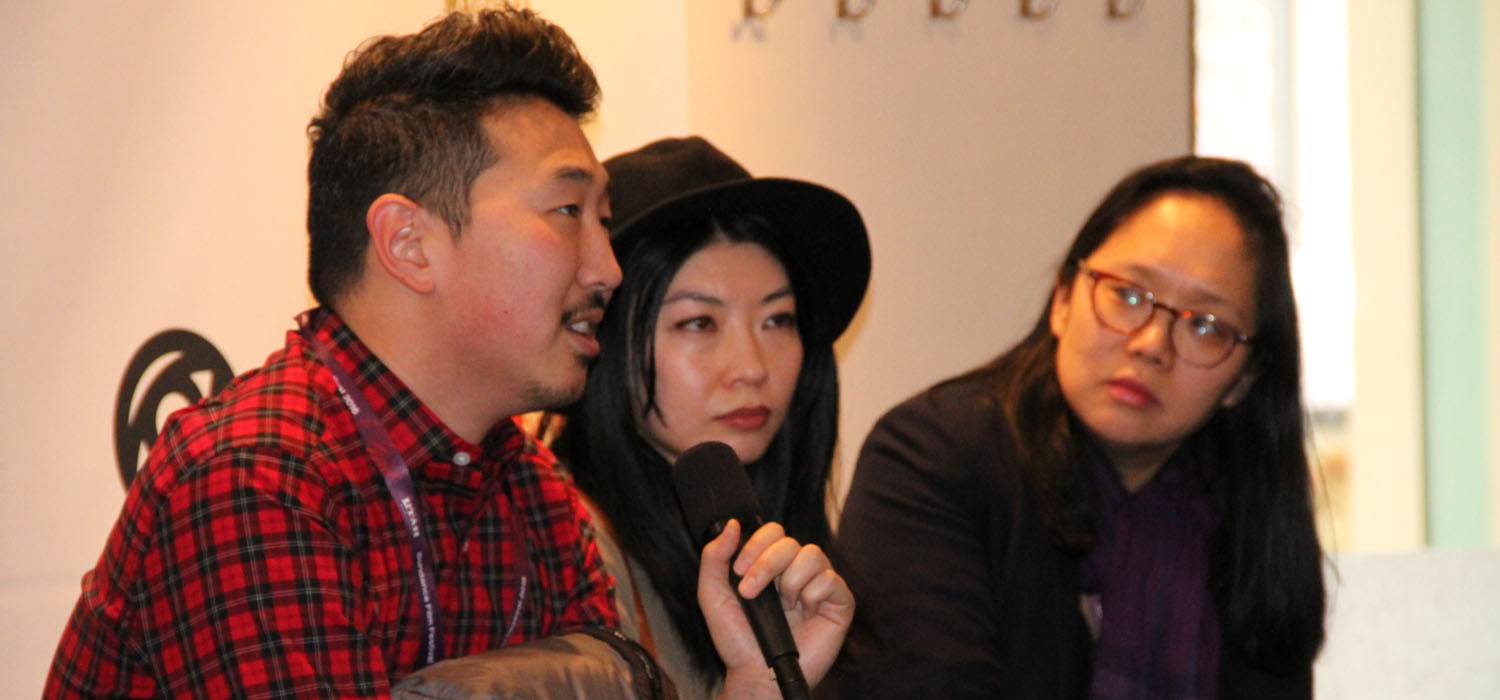 At a panel during the 2016 Sundance Film Festival, Director Andrew Ahn articulates the challenges of bringing minority perspectives and voices to the mainstream as director Mila Zuo and moderator Irene Cho listen in. (Photo: Abraham Ferrer/Visual Communications Photographic Archive)