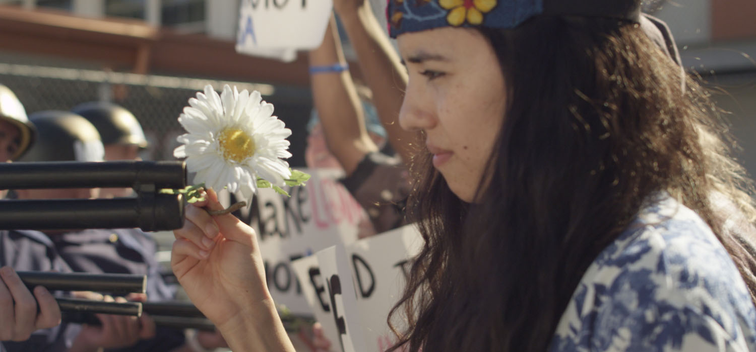 An anti-war protestor (Cynthia Callejas) tries to conquer with love in a scene from Quyên Nguyen-Le's NUʼÔʼC. (Photo: Courtesy the filmmaker)