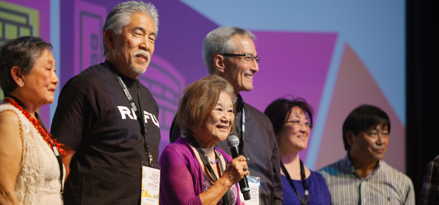 As fellow Digital Histories filmmakers Fran Ito, Steve Nagano, David Osako, NJ Nakamura, and Glen Kanemoto listen in, director Michi Tanioka (with mic) answers an audience question regarding her documentary IT AIN'T HEAVEN, BUT CLOSE 'NUFF (Photo: Brandon Okumura)