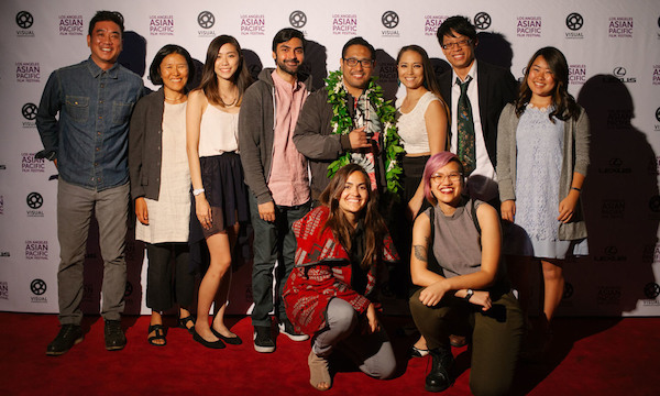 VISUAL COMMUNICATIONS' DIRECTOR OF PROGRAMS AND ARTISTS' SERVICES MILTON LIU AND AWC ADVISER ANN KANEKO WITH ARMED WITH A CAMERA 2015-2016 FELLOWS (KNEELING, L-R): TULICA SINGH AND QUYÊN NGUYEN-LE; (STANDING) KAYLA TONG, FAROUKH VIRANI, CONRAD LIHILIHI, SUMIKO BRAUN, STANLEY WONG. AT FAR RIGHT IS DIRECTOR KRISTY ISHII, OF UCLA'S VIDEO ETHNOGRAPHY WORKSHOP OF THE CENTER FOR ETHNICOMMUNICATIONS. (PHOTO: BRANDON OKUMURA)