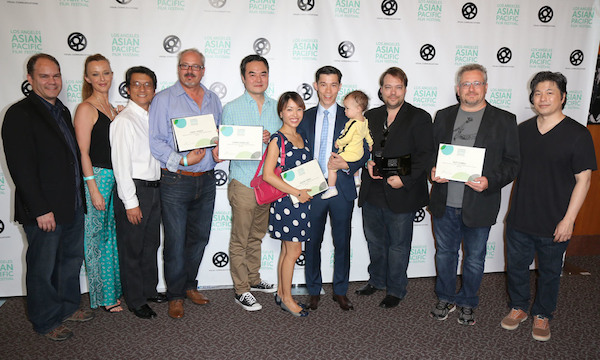 2015 LOS ANGELES ASIAN PACIFIC FILM FESTIVAL GRAND JURY PRIZE FOR BEST FEATURE GOES TO JASMINE, DIRECTED BY DAX PHELAN. HERE, THE TEAM FROM JASMINE CELEBRATES ITS FIVE AWARDS. FIFTH FROM LEFT: CHRIS CHAN LEE (WINNER, BEST EDITING); SEVENTH FROM LEFT: JASON TOBIN (WINNER, BEST ACTOR IN A DRAMA); THIRD FROM RIGHT: DAX PHELAN (DIRECTOR); SECOND FROM RIGHT: GUY LIVNEH (WINNER, BEST CINEMATOGRAPHY). (Photo: Steven Lam)