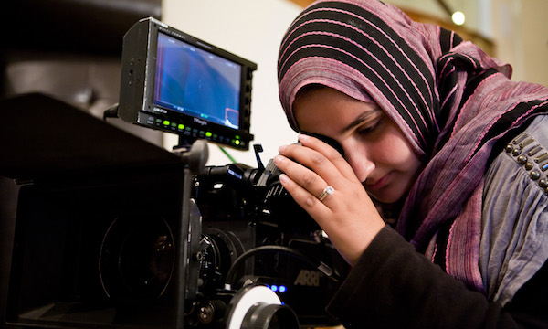 DIRECTOR LENA KHAN LINES UP A SHOT ON THE SET OF HER FEATURE NARRATIVE DEBUT, "THE TIGER HUNTER," THE FILM FESTIVAL'S OPENING NIGHT PRESENTATION. (PHOTO: COURTESY THE FILMMAKER)