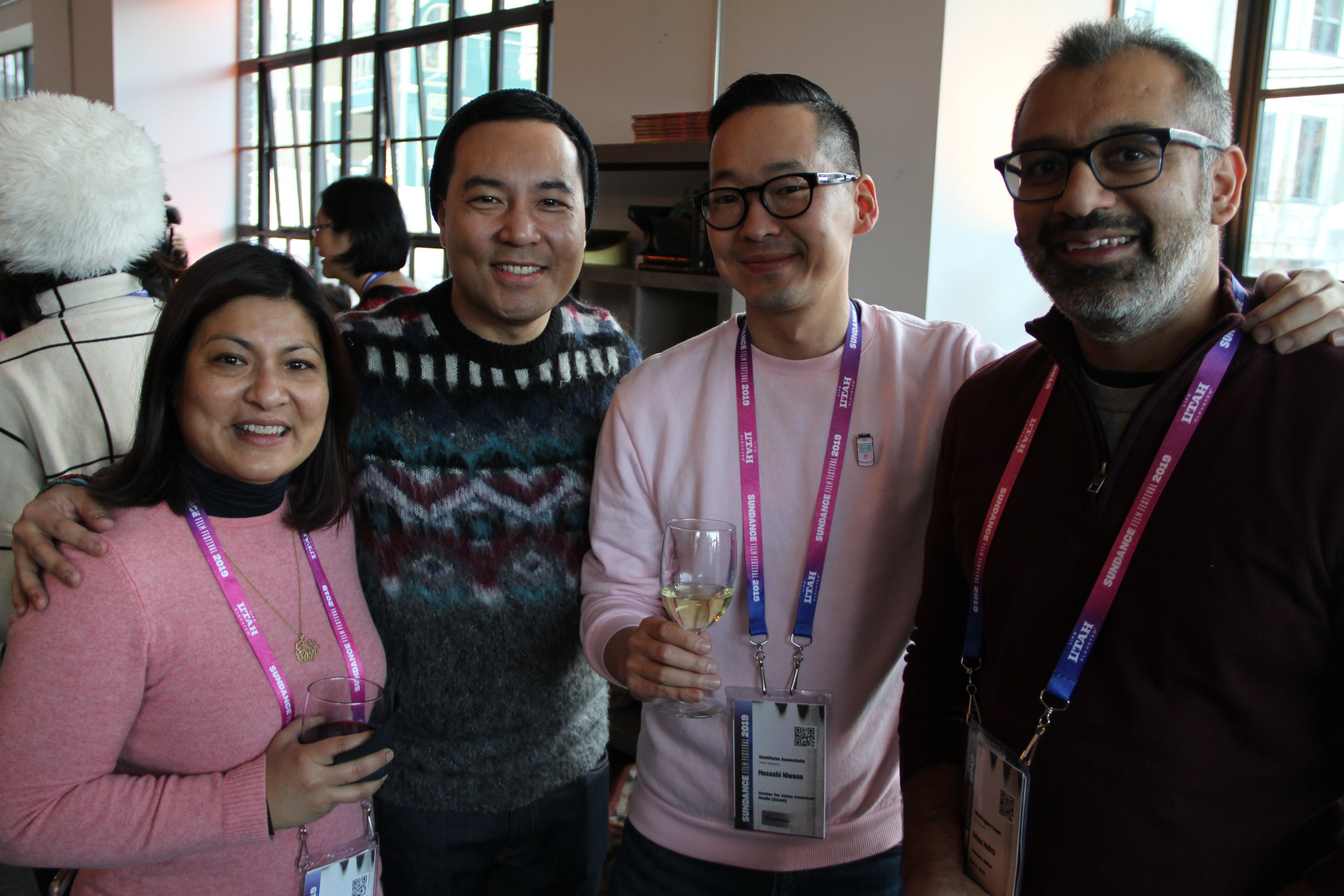  CAAMsters Sapana Sakya and Masashi Niwano greet John D. Lee and filmmaker Soham Mehta at the Asian Pacific Filmmakers Experience in Park City’s RYOT &amp; VICE Studios meet-up. (Photo: Abraham Ferrer/Visual Communications Photographic Archive) 