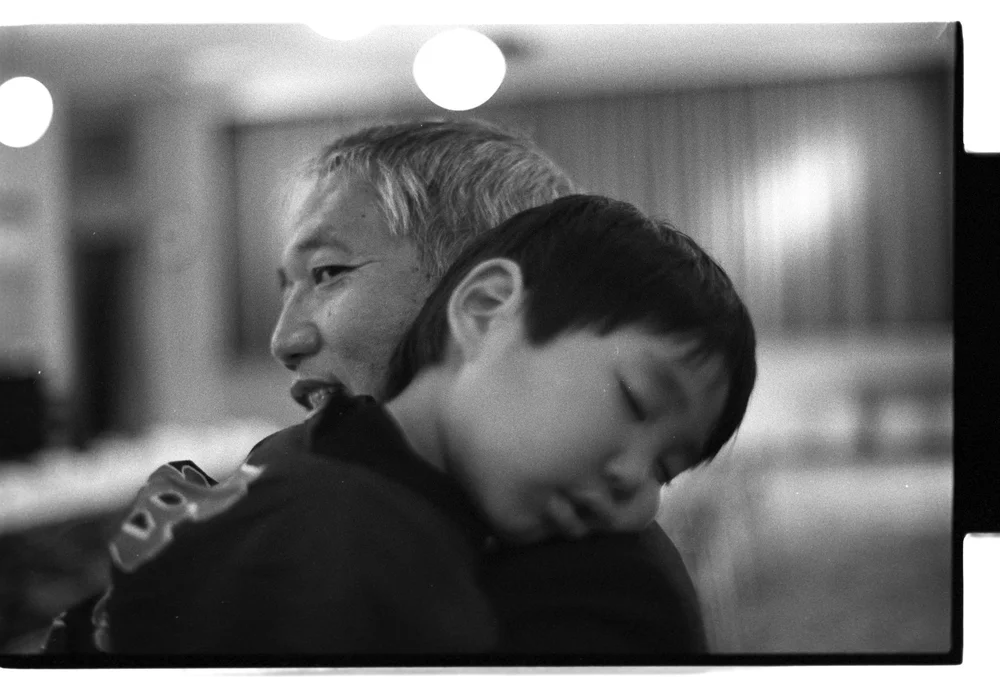  Tadashi Nakamura takes a name on his father’s (Robert Nakamura) shoulders. (Visual Communications, 1984) 