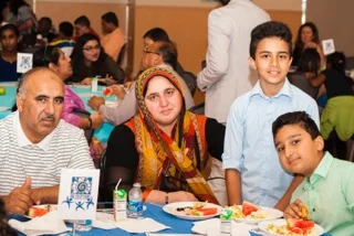 Families join students and mentors in celebrating at the Academic Achievement Banquet. 