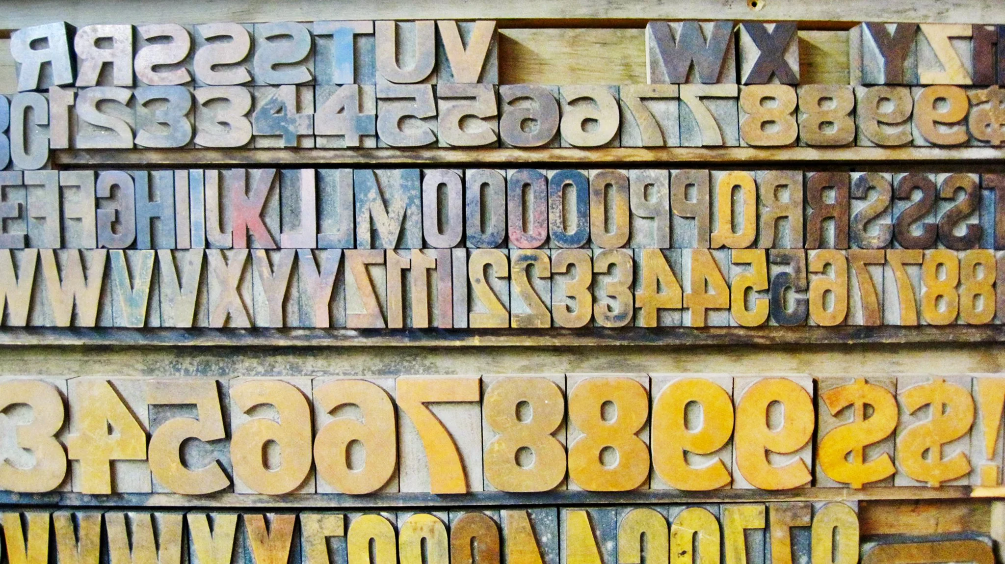 Set of hand carved letter press letters. 