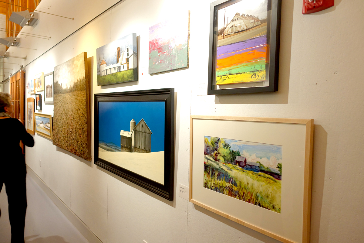 That's my painting, Berkshire Barns, at the bottom front. The acrylic with the blue sky next to it won second place. First prize went to the large canvas of the field just beyond, made of—not kidding—acrylic and dirt.