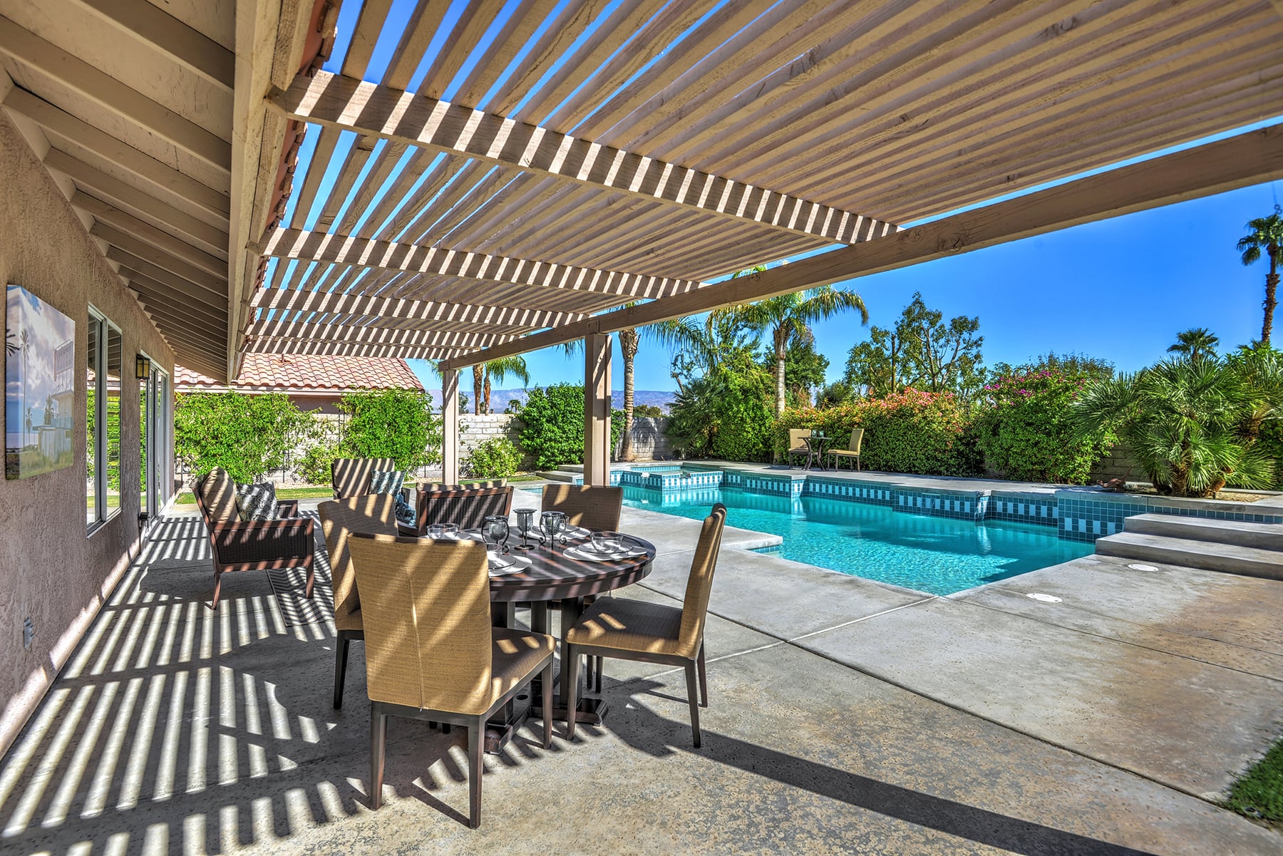 OUTDOOR COVERED DINING TO POOL MLS.jpg