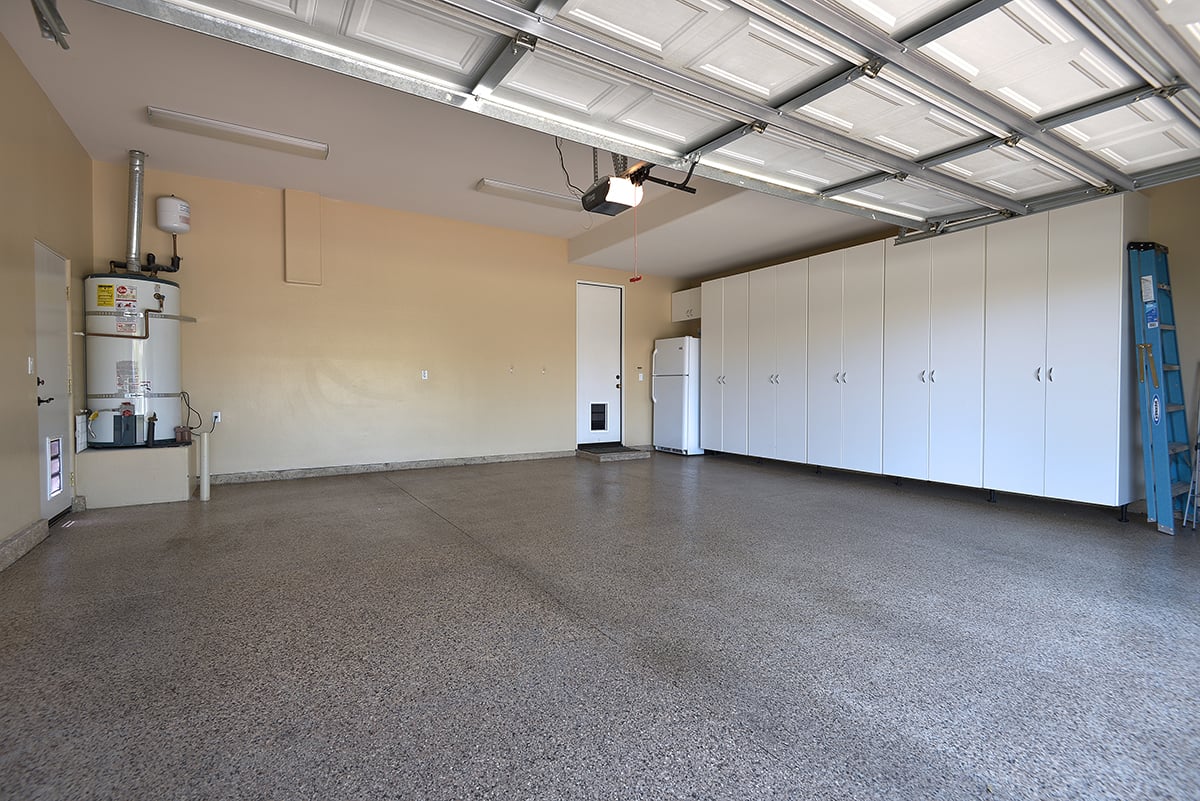 GARAGE WITH EPOXY FLOOR AND BUILT IN CABINETS MLS.jpg
