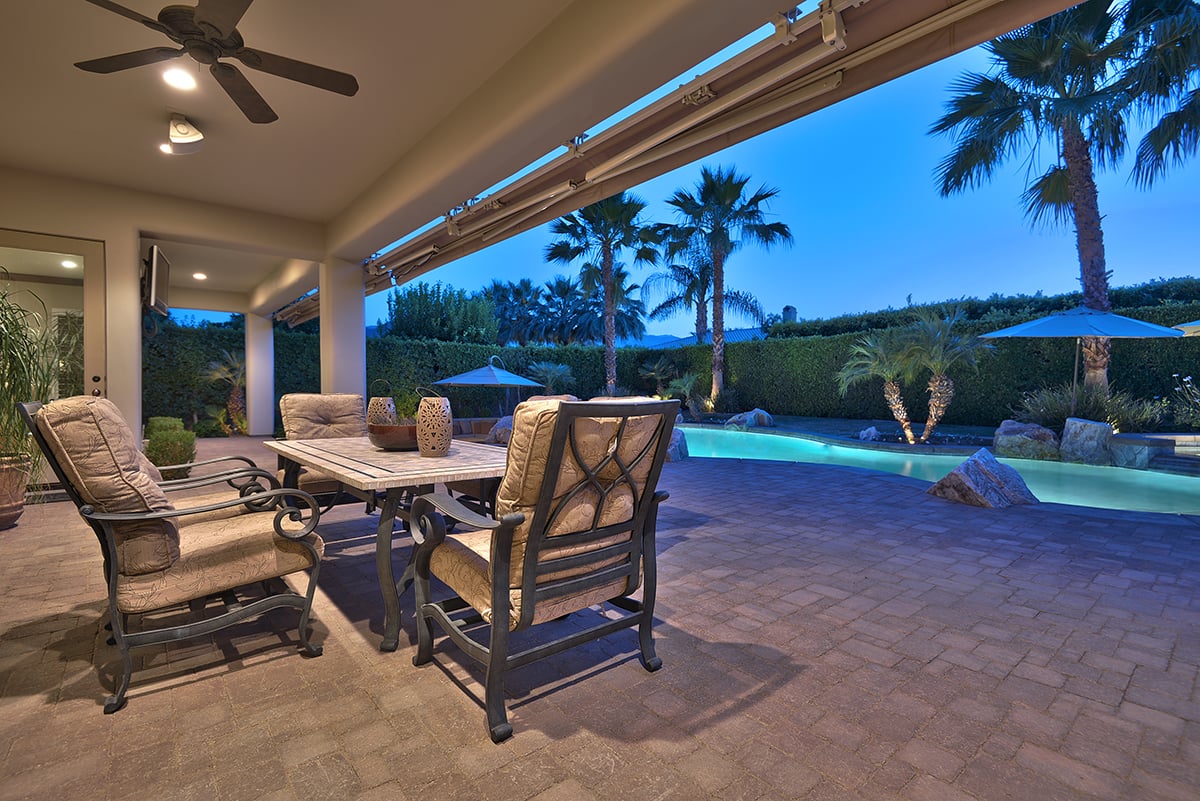 OUT FROM COVERED PATIO TO POOL NIGHT MLS.jpg