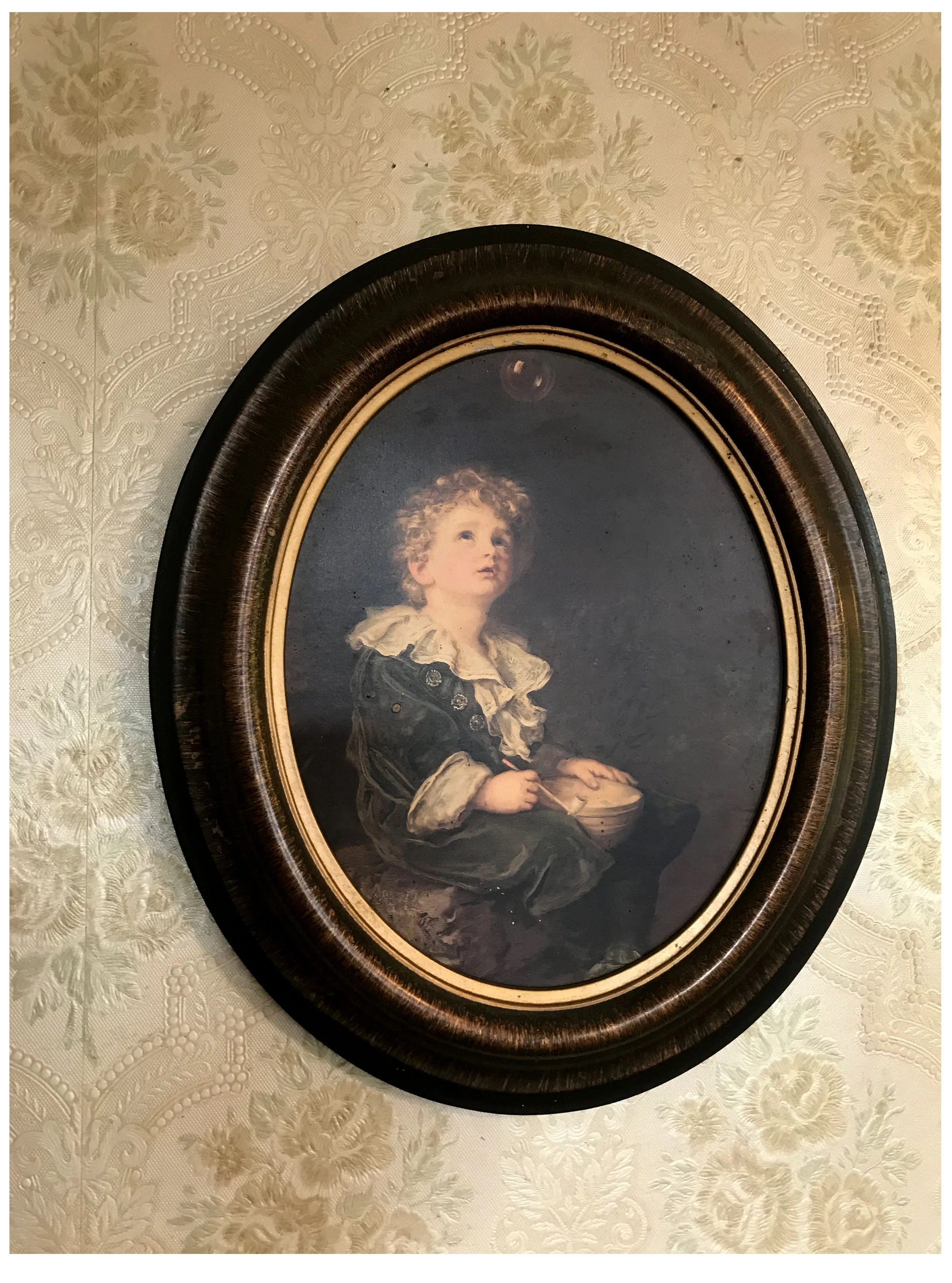 Boy with his bubble on my parent's wall, December 2017