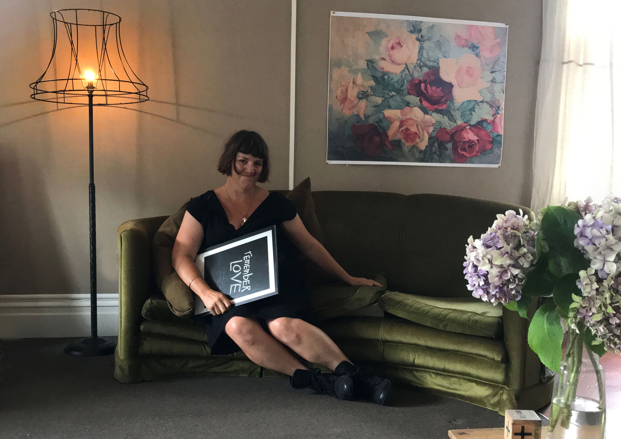 Me in my lounge (the site for the exhibition) along with testprints for the show, January 2018