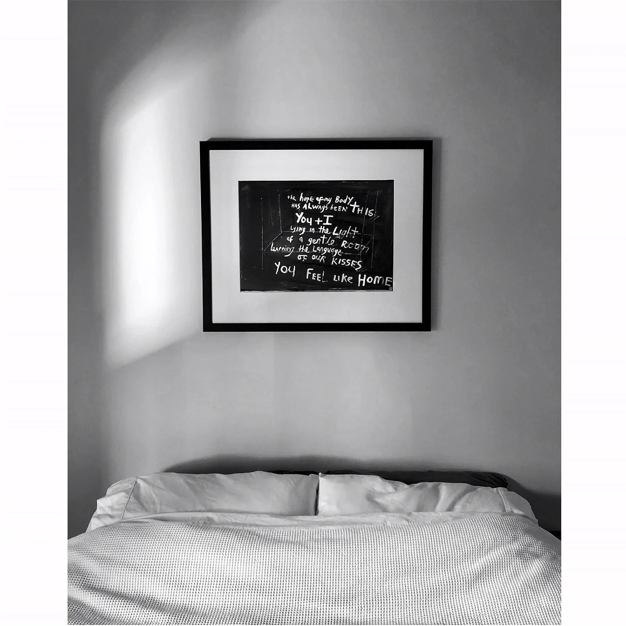  FROM ONE LOVER TO ANOTHER  //⁠⠀  ⁠⠀⁠⠀  The owner of this medium size print of    the hope of my body, 2020     sent me this:  "My lover sent me this beautiful art work, it arrived today. Wow, I’m bowled over by how exquisitely tender it is. Thank you for creating such incredible work."⁠⠀  ⁠⠀  T bought this for his partner, P, during lockdown. They live in different cities, in different islands even.  It was such a romantic gesture that it made my heart glad to send it.  Especially since I'd created the work as a response to the big tender feelings I have for my own partner.⁠⠀  ⁠⠀  I LOVE that P has positioned it above her bed - if you look close, in the background of the artwork, behind the words, is a bed.  I love the mirroring.  Bed with bed. ⁠⠀  ⁠⠀  The hope of my body⁠⠀  has always been this:⁠⠀  you and I⁠⠀  lying in the light⁠⠀  of a gentle room⁠⠀  learning the language ⁠⠀  of our kisses.⁠⠀  You feel like home.⁠⠀   