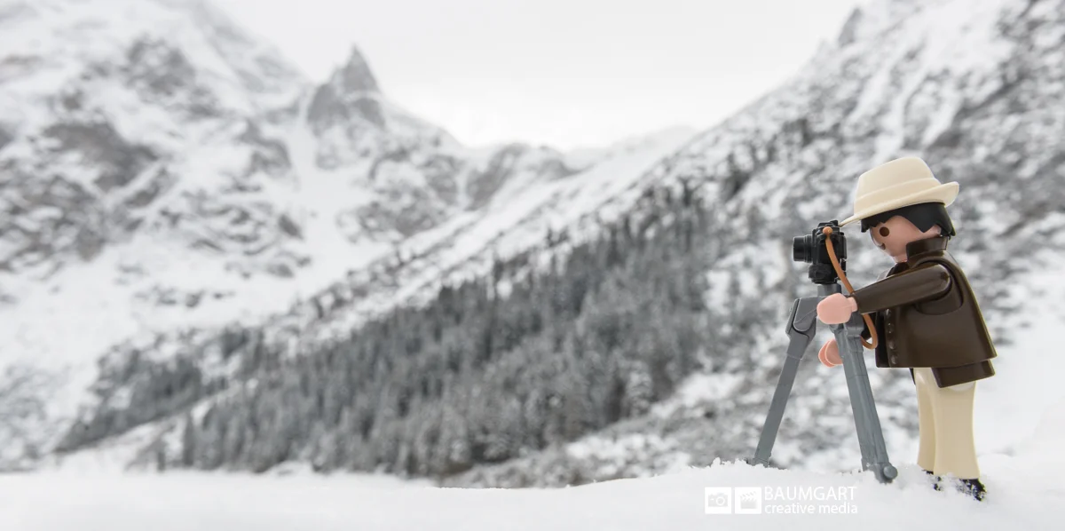Playmobil photographer in the snowy mountains by Jeff Baumgart
