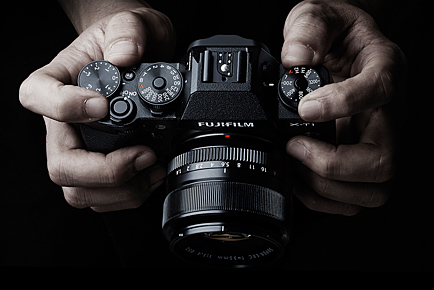 Not a shot of my hands holding an X-T1, but it does illustrate the top-panel layout, and where all the controls fall. Of course, there are buttons and switches on the back and front of the body as well.