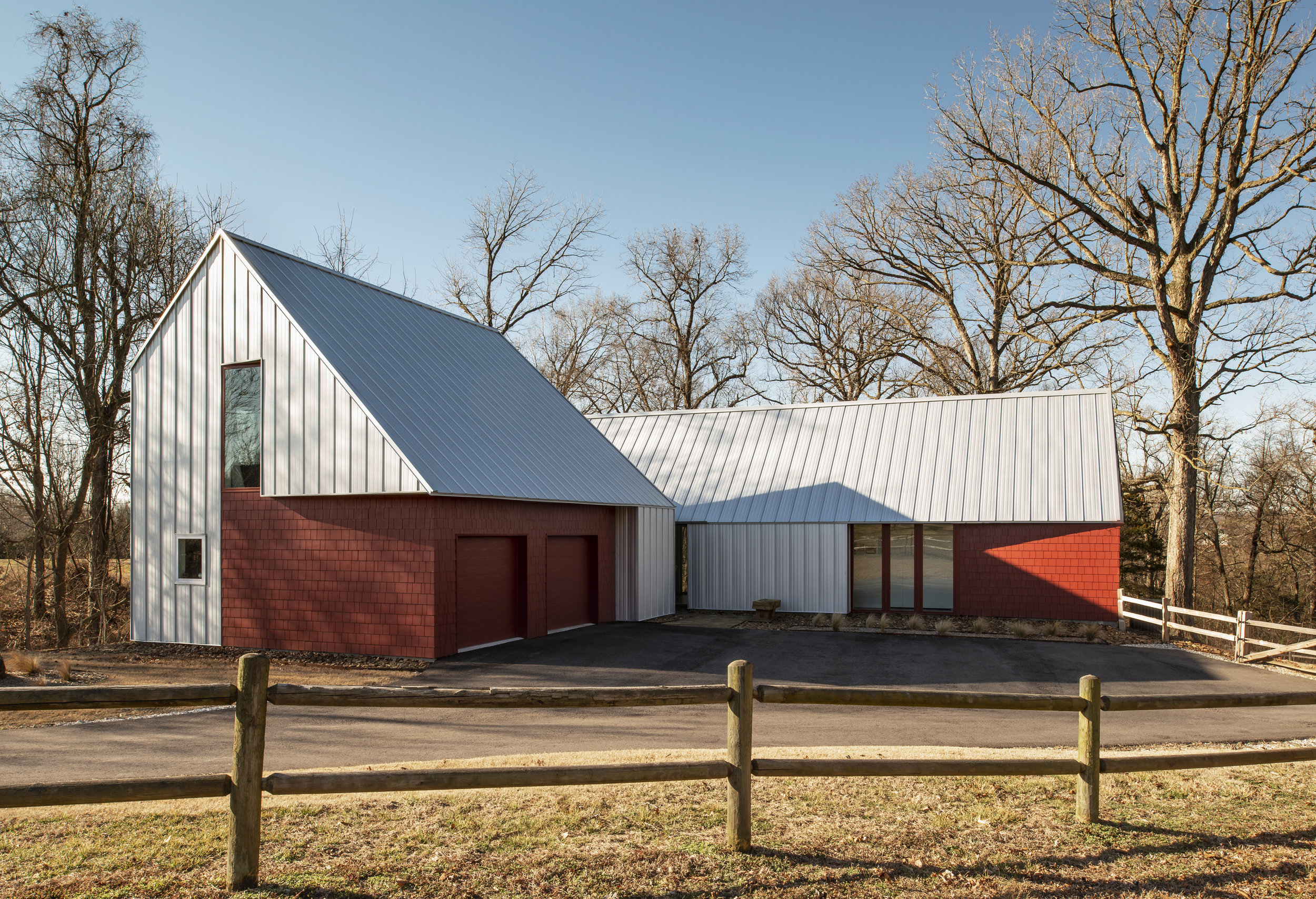   Goshen Arkansas | 2018    The Hillside Rock House is located on a dramatically sloping three-quarter acre wooded site. The house is designed as an abstract geologic outcropping whose form emerges from physical transformation in response to the desi