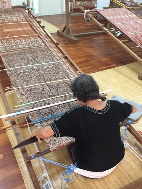 A local weaver working on a intricate Pua Kumbu piece at the Tun Jugah Foundation.