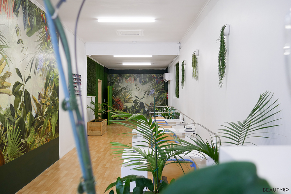 A leafy waiting room for a beauty nail salon