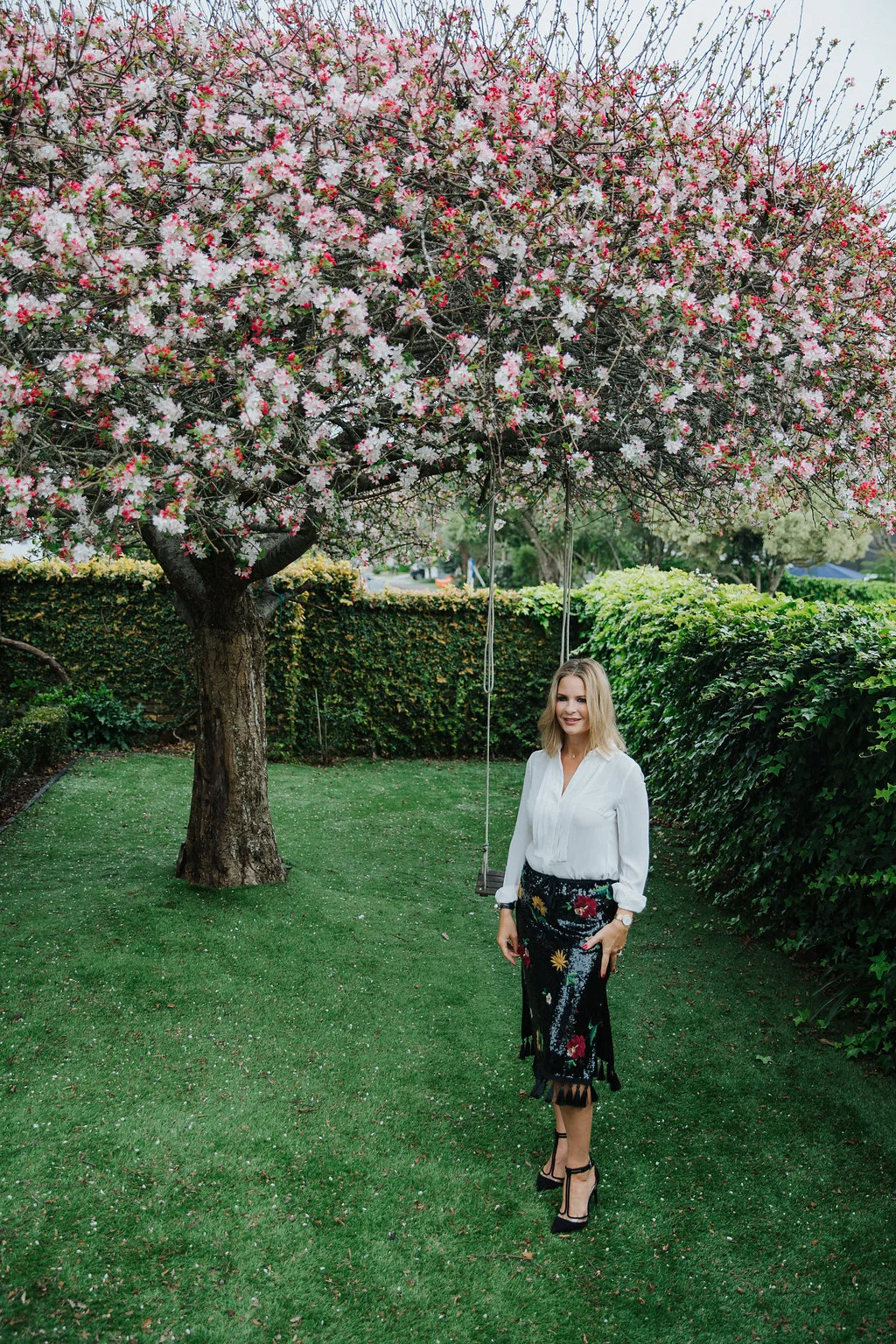 Grove in her garden with her beloved blossom that flowers for only one week of the year.