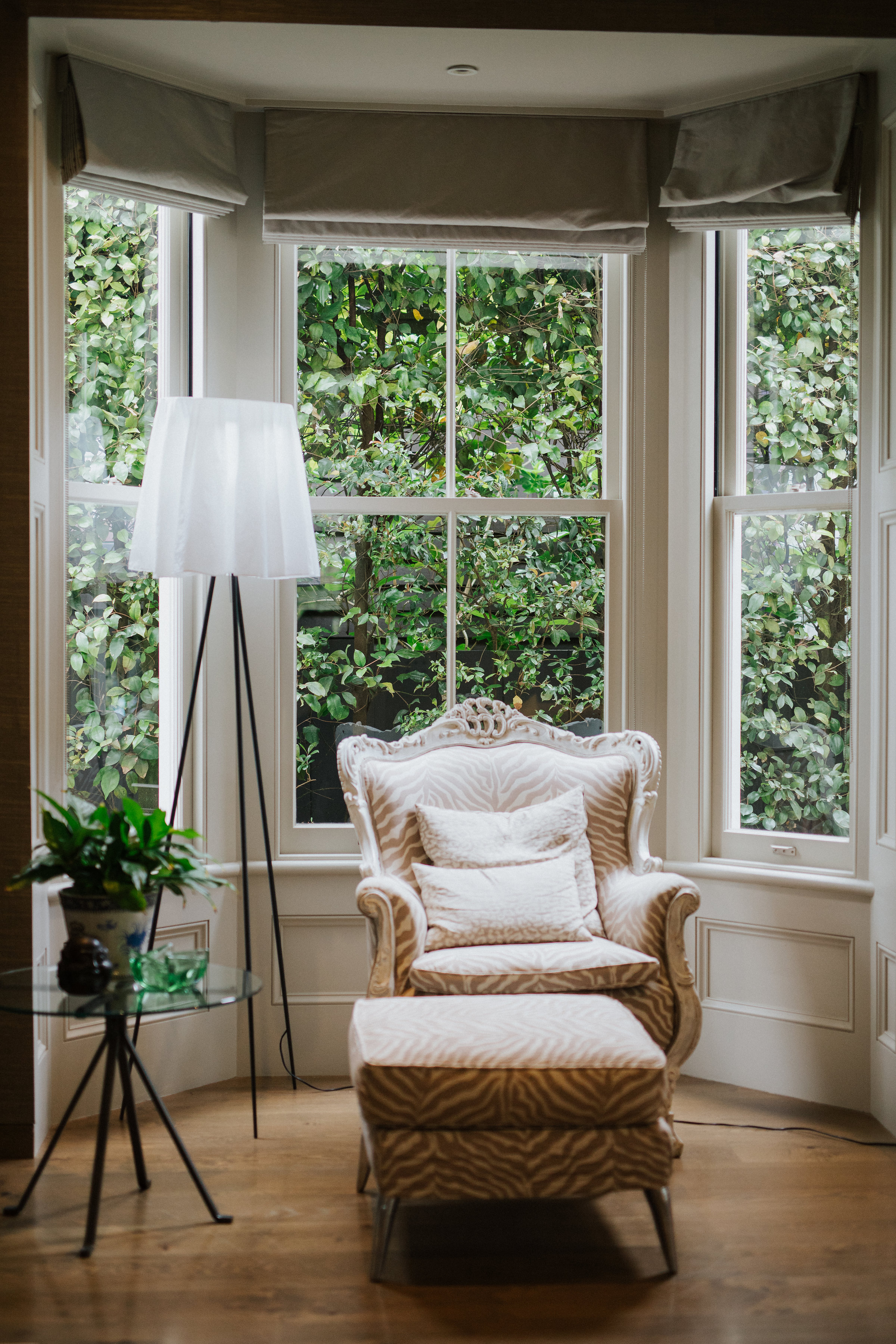 Living space with sofa and big windows 