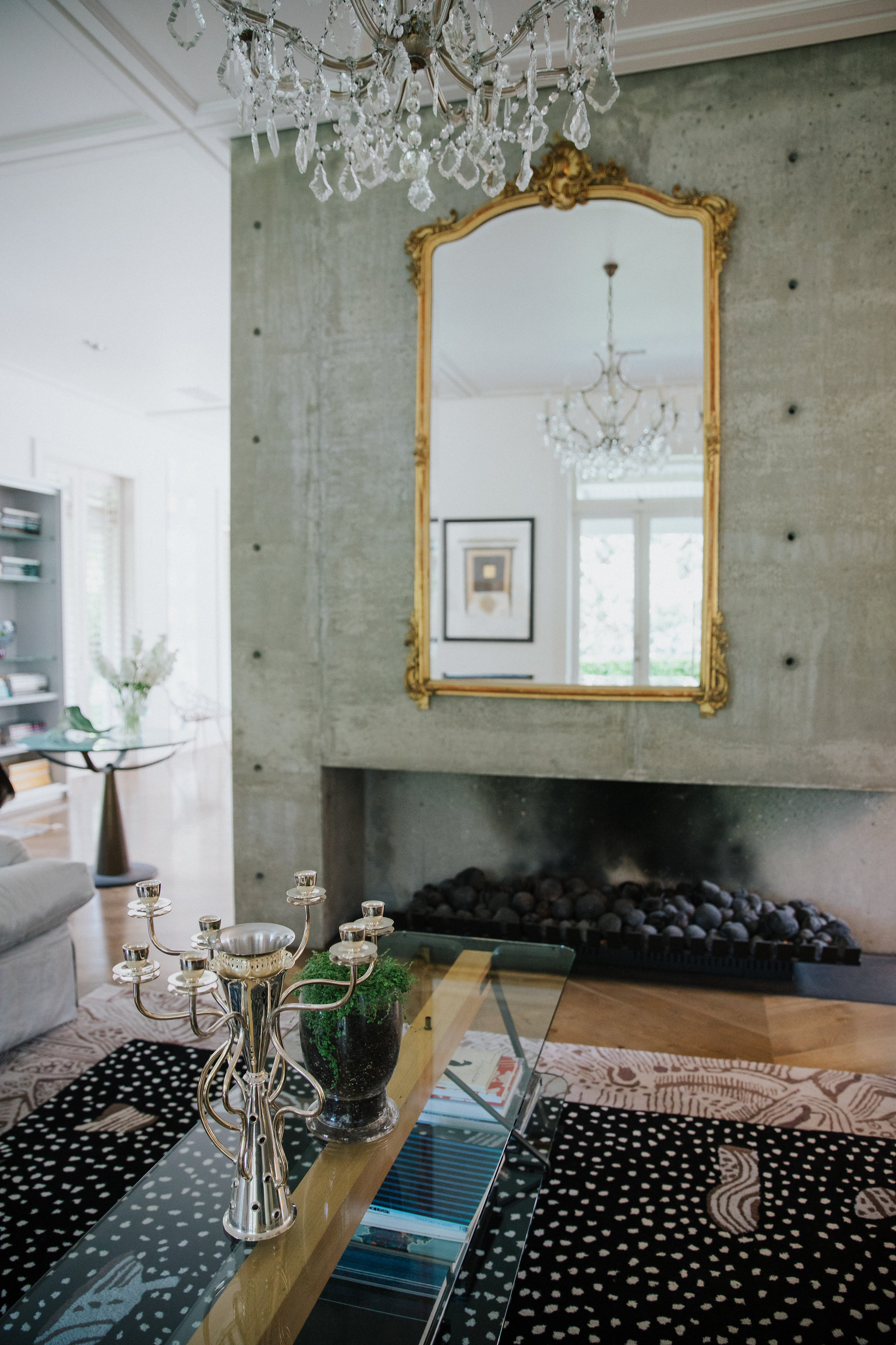 Mirror on green wall in living room 