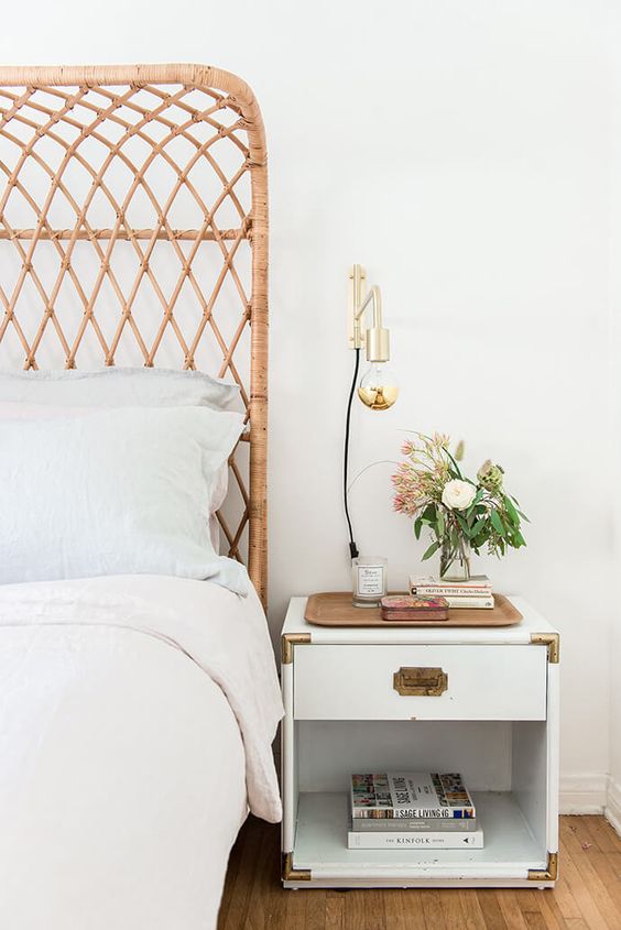 White bed with cane headboard