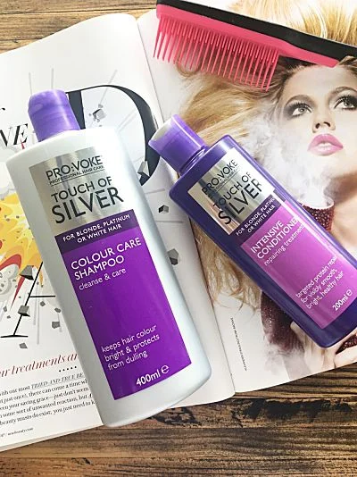 Pro:Voke Touch of Silver, for blonde, platinum or white hair in purple and silver bottles laid out on an open magazine