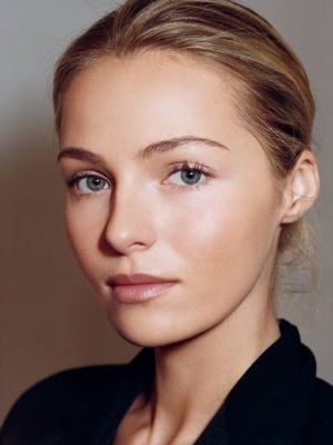blonde model with hair pulled back and natural makeup