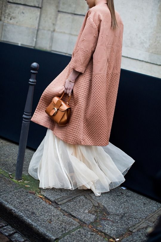 woman in white dress and pink coat