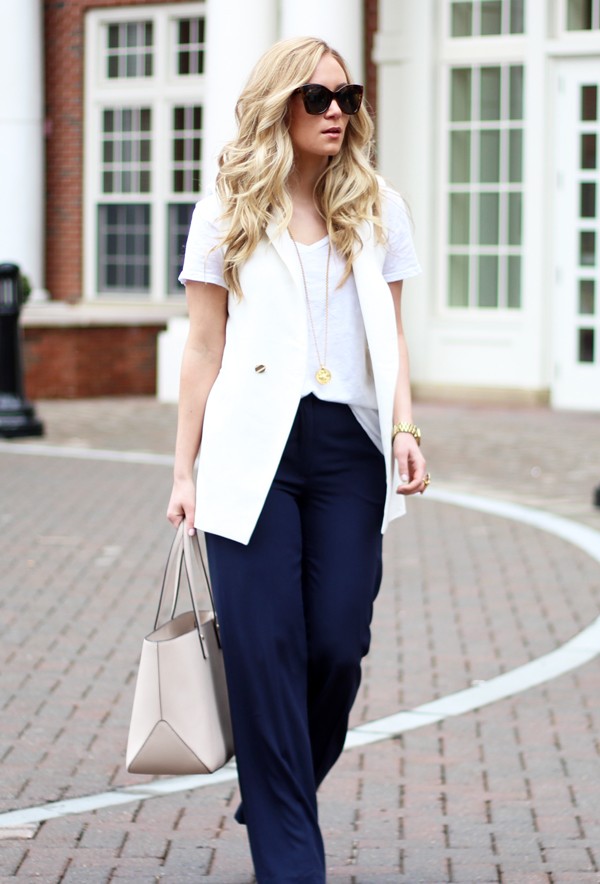 woman in navy pants and white top