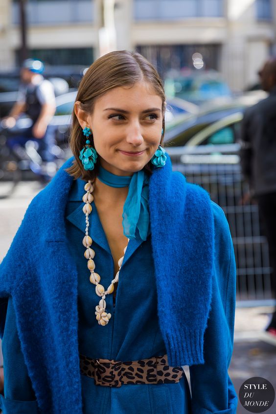 Brunette woman in full blue outfit