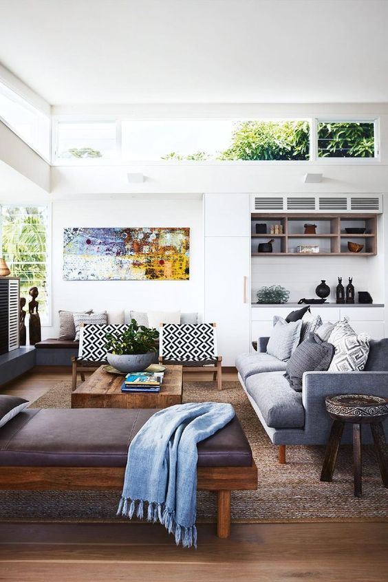 Modern white room with brown leather sofa 