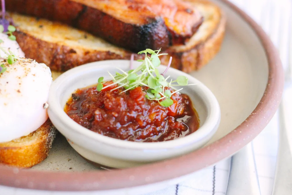 Sour dough, bacon & poached eggs with tomato relish