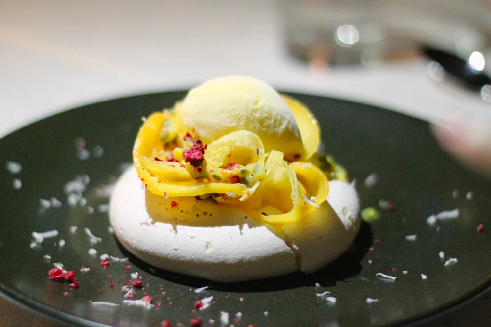 Pavlova, coconut custard, pineapple, passion fruit sorbet. 