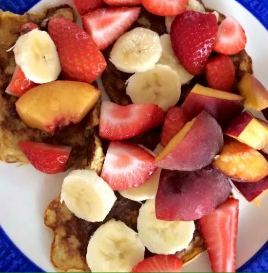 Healthy pancakes topped with Nutella & delicious fruit