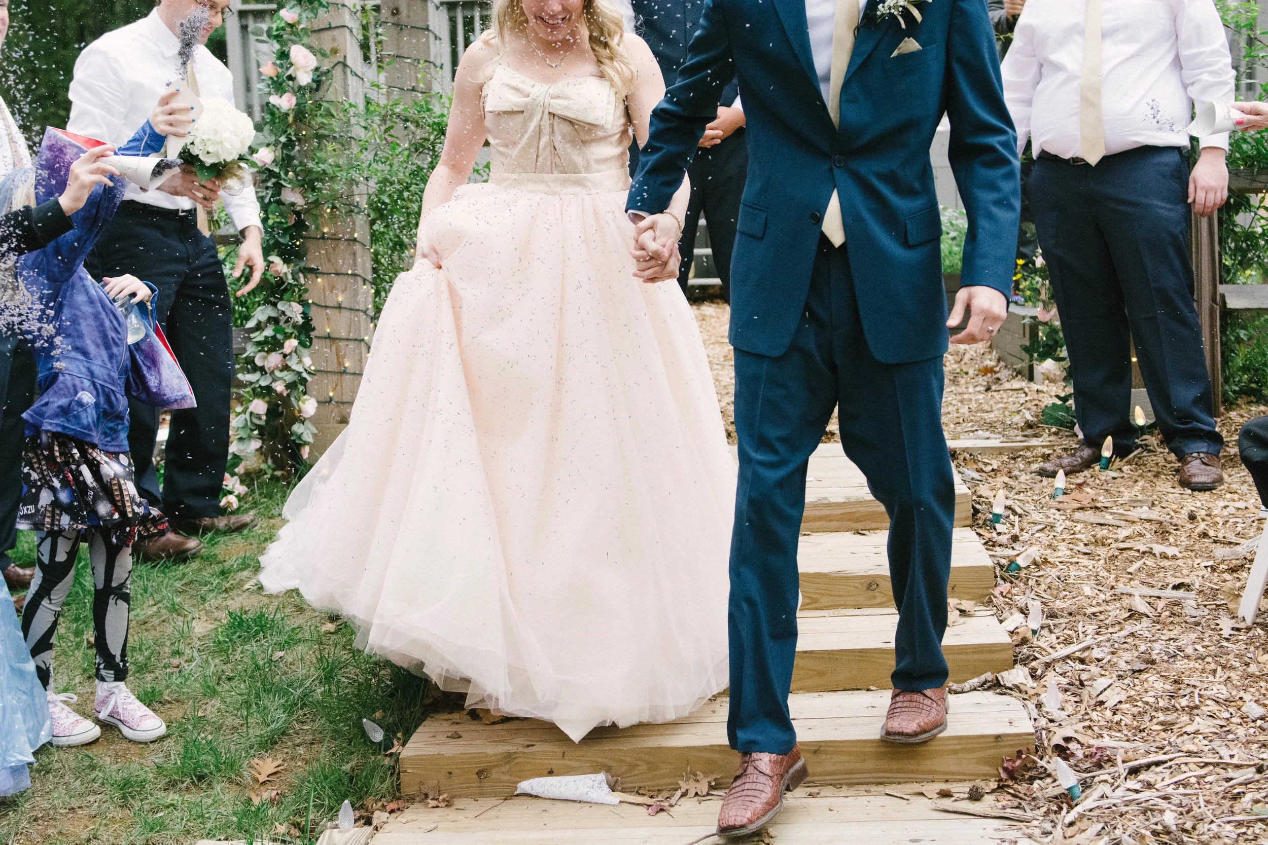 "Caroline was our photographer, and she was amazing! She came to meet with us at the wedding venue beforehand and although I didn't feel like I did a good job of explaining what I wanted (because I didn't really know), she captured everything beautifully and exactly as I had hoped. She was very patient with our families for the portraits and my lack of direction. She managed to get everyone in the pictures quickly and they turned out to be stunning. I also loved the time she took with the pictures of just the Groom and me. They are gorgeous! Thank you both for all of your hard work and patience, it was a wonderful experience and you helped it flow seamlessly!" - Allegra