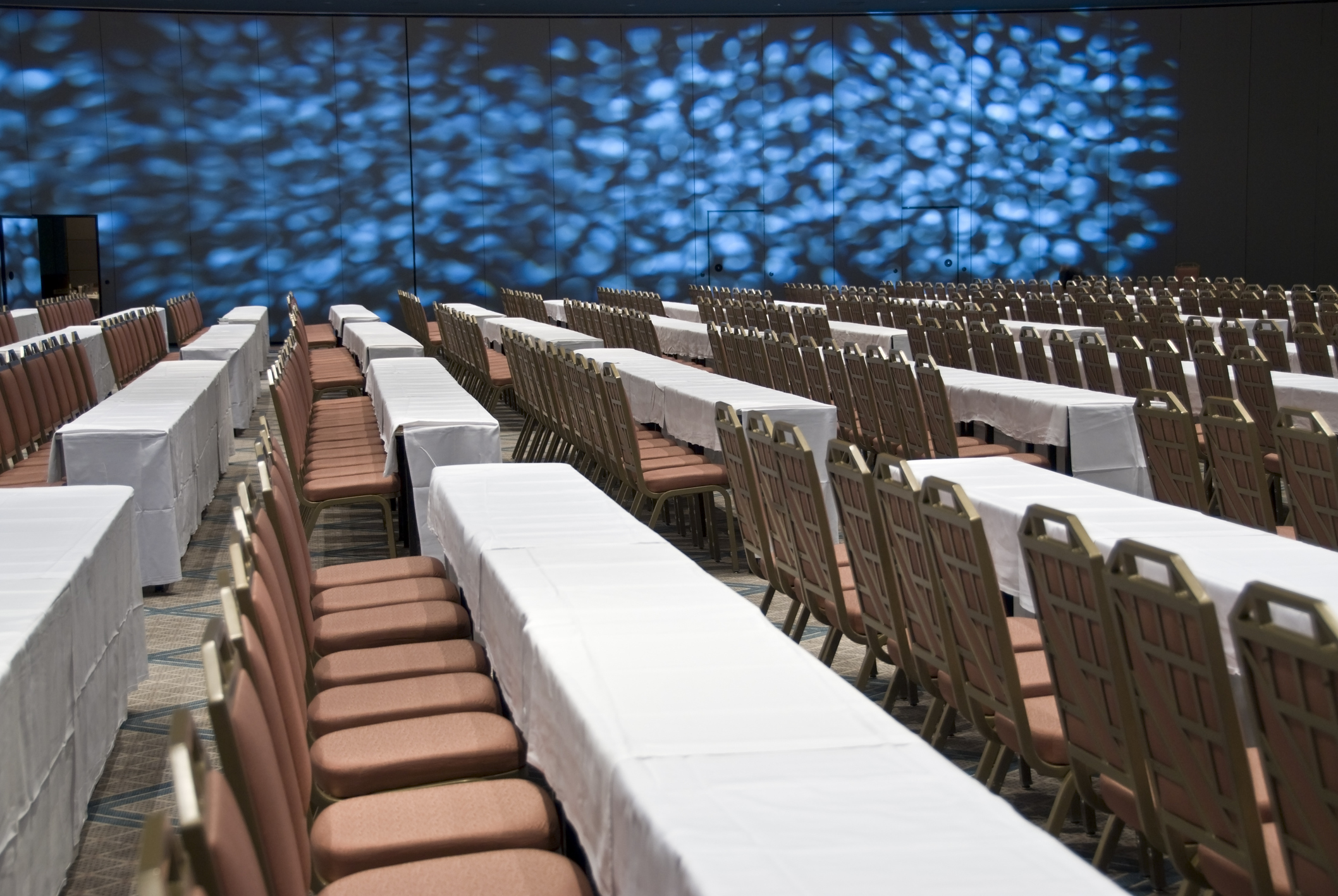 Typical conference ballroom set up. Not a place where you'd want to spend an hour, let alone a day. The upside is the table, where you can lay your head when you want to take a nap.