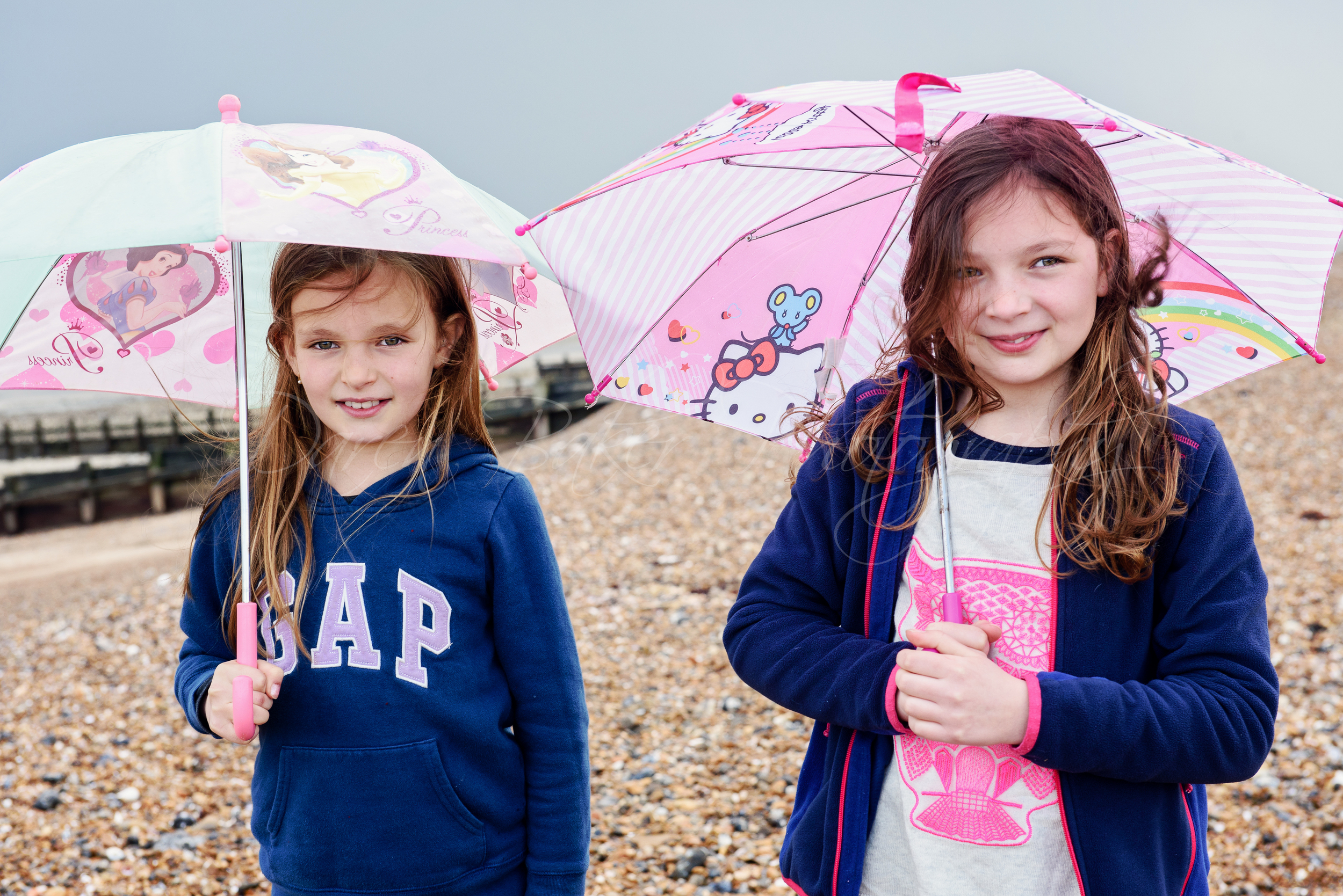 Umbrellas and girls, beach shoot,, Ferring Sussex
