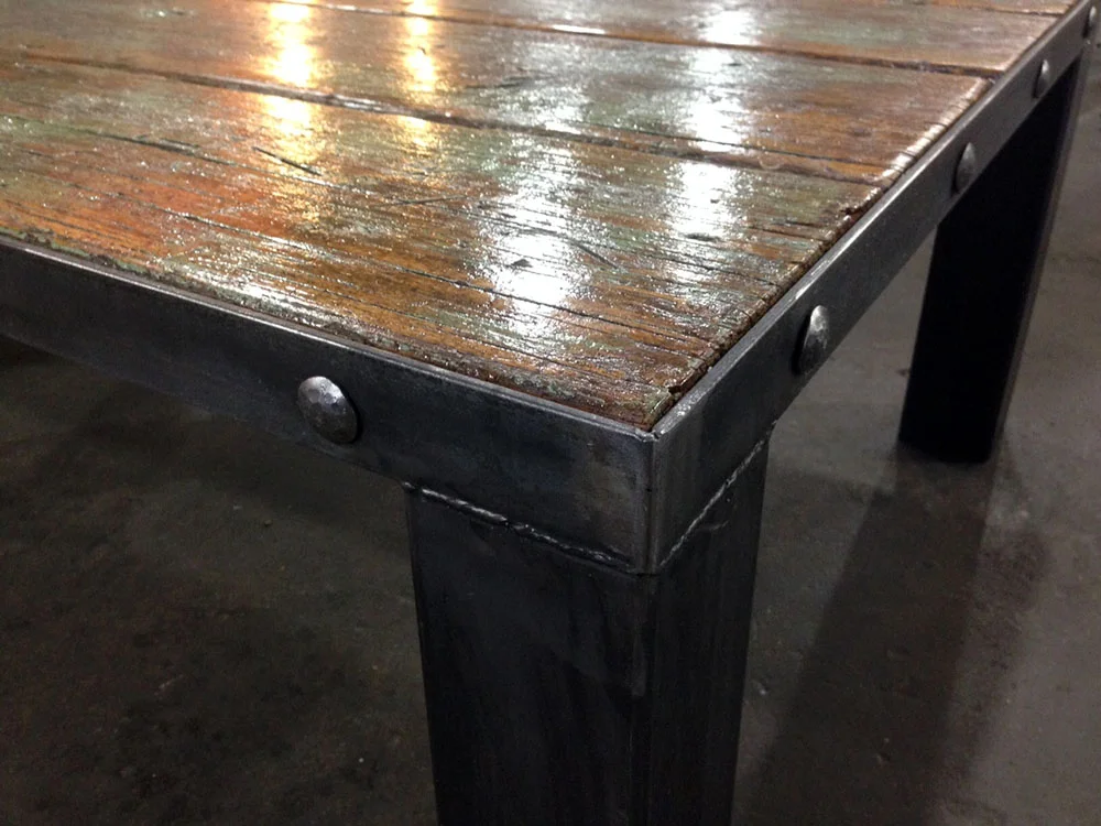  Hand hammered rivets give the table old world style. 
