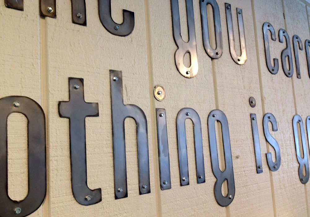  Simple screws hold the letters to the wall. Just create your baseline to layout the designs and get installing. 