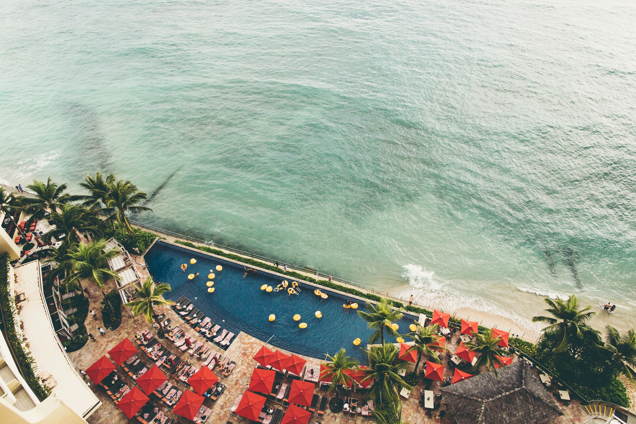 The Sheraton Waikiki pool down below. Still kicking myself for not jumping in during our stay.